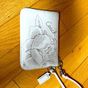 Beautiful embossed coach wristlet